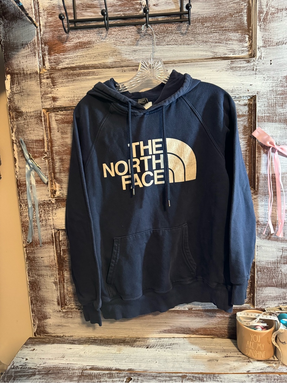 The North Face Navy Blue Hoodie with White Logo